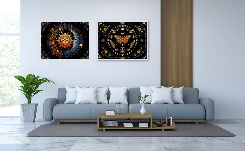Two framed celestial and floral diamond art paintings hanging on a wall above a sofa.