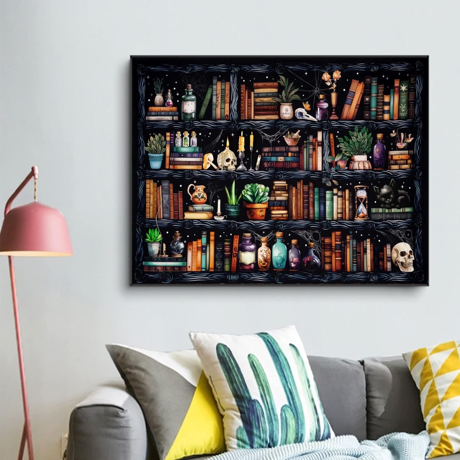 Goth skull bookshelf diamond painting kit displayed on a wall above a sofa.