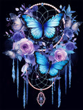 Dream catcher with blue butterflies and purple roses, featuring dangling strands and a central pendant.