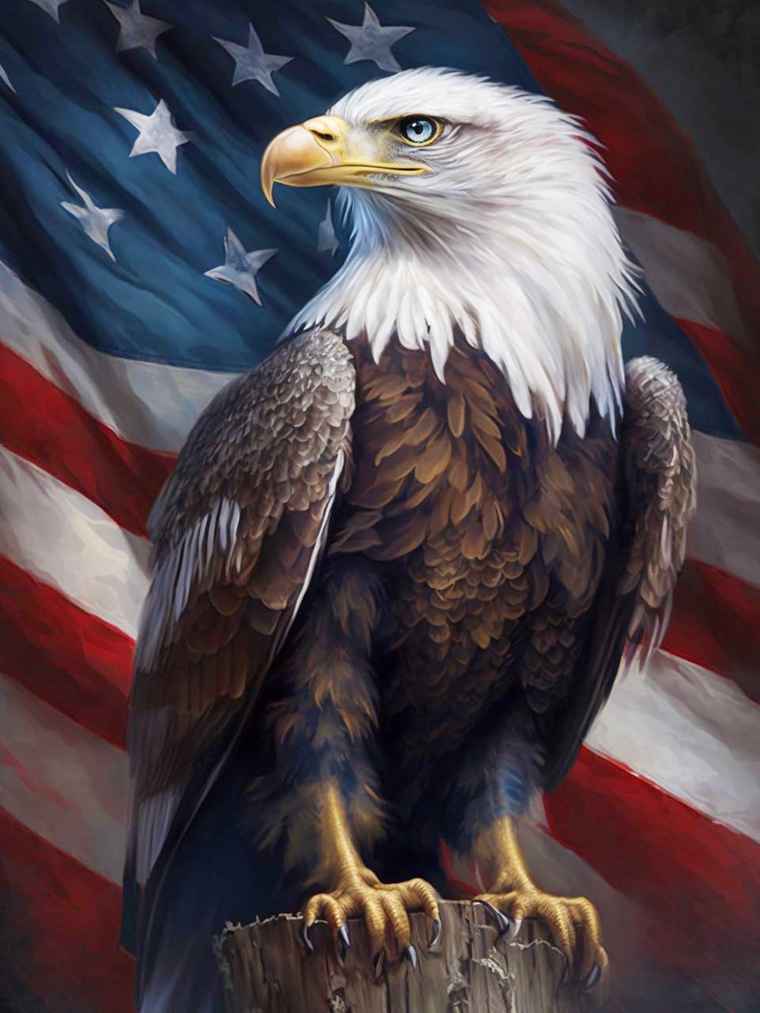 Bald eagle perched on wood in front of the American flag
