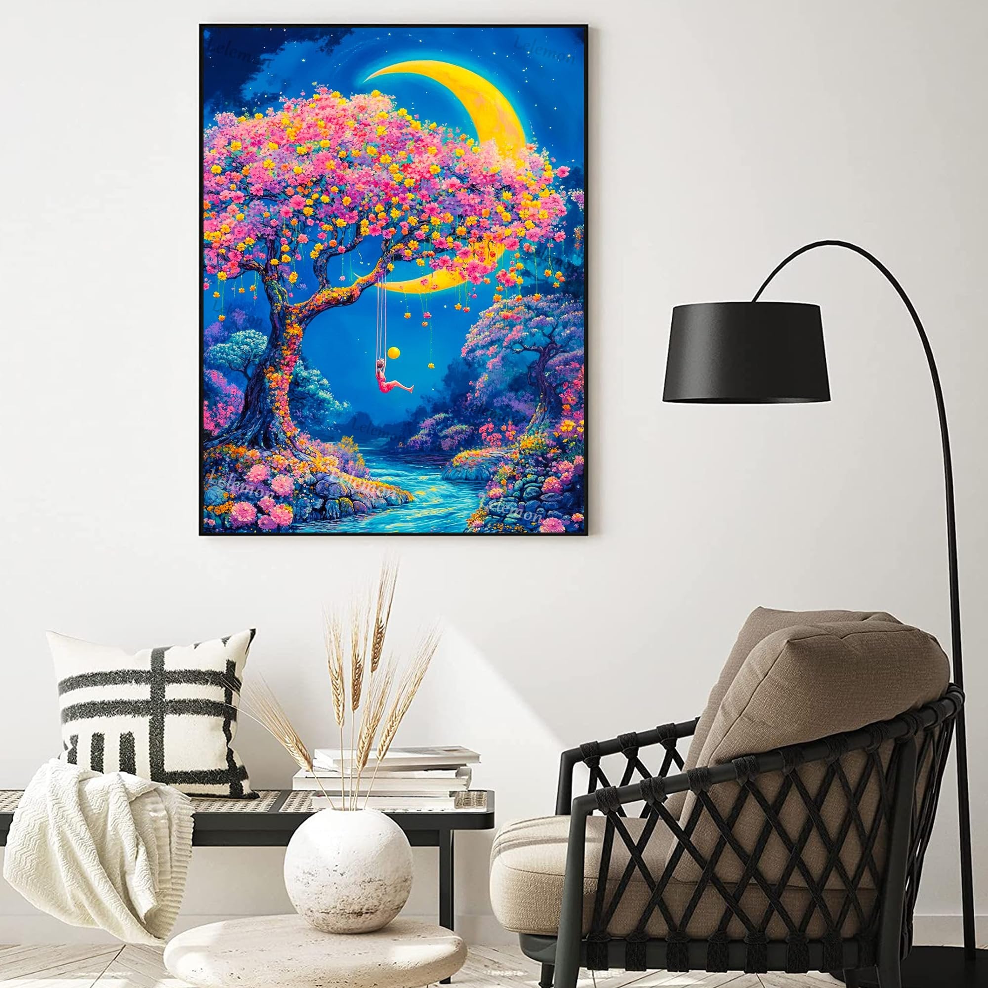 Diamond painting kit artwork of a whimsical tree with pink and yellow blossoms, a crescent moon, and a person on a swing over a river.