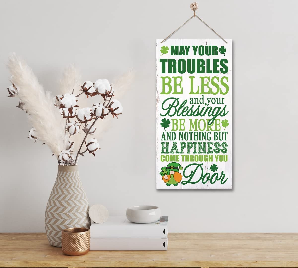 White wooden sign with green text and a leprechaun graphic, featuring an Irish prayer for St. Patrick's Day.
