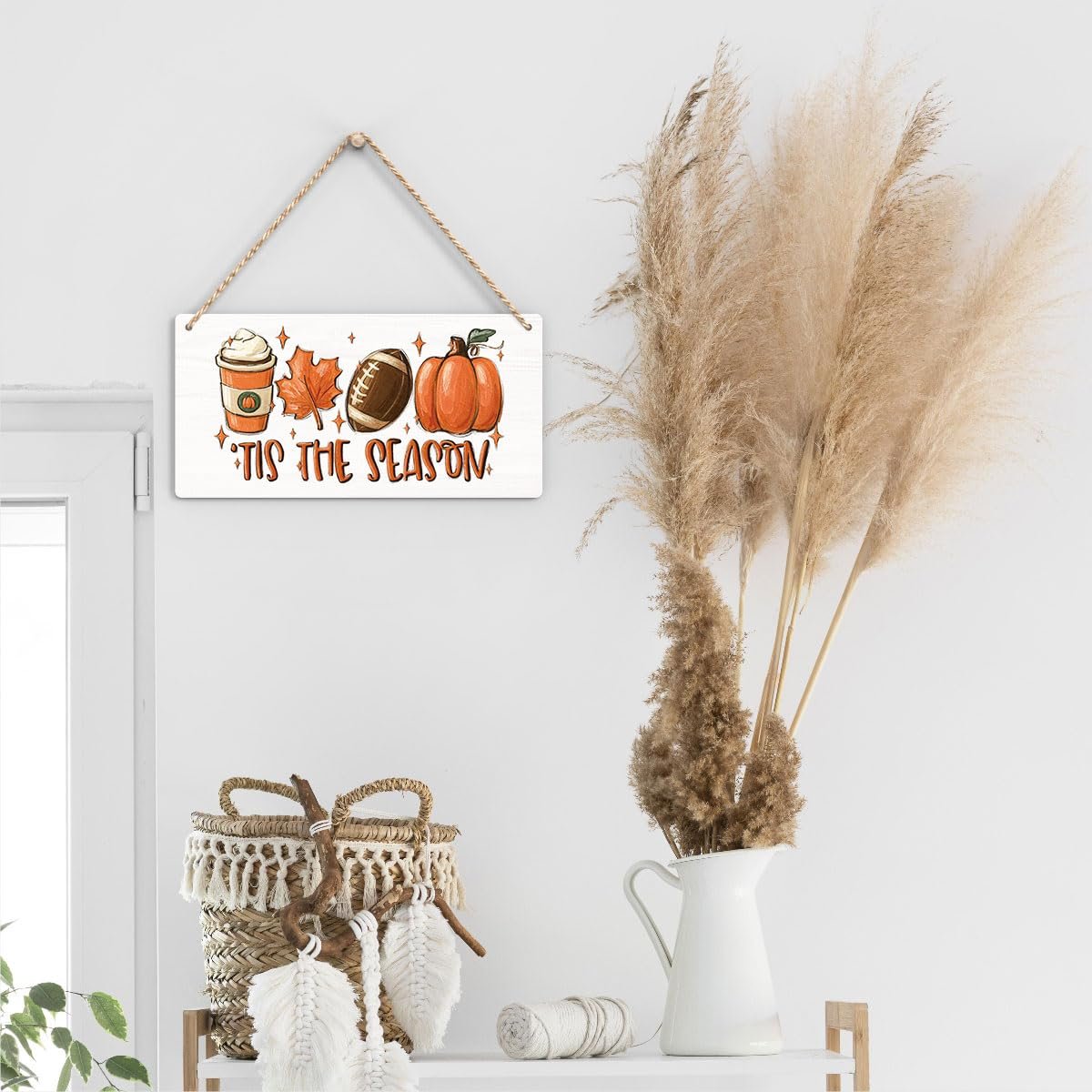 Wooden fall hanging sign with coffee cup, maple leaf, football, and pumpkin graphic, reading 'Tis the Season'.