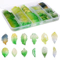 Assortment of 120 glass leaf beads in a divided plastic case and displayed individually.