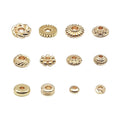 Twelve gold-plated spacer beads in various styles arranged in three rows on a white background.