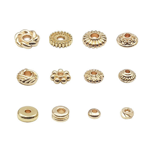 Twelve gold-plated spacer beads in various styles arranged in three rows on a white background.