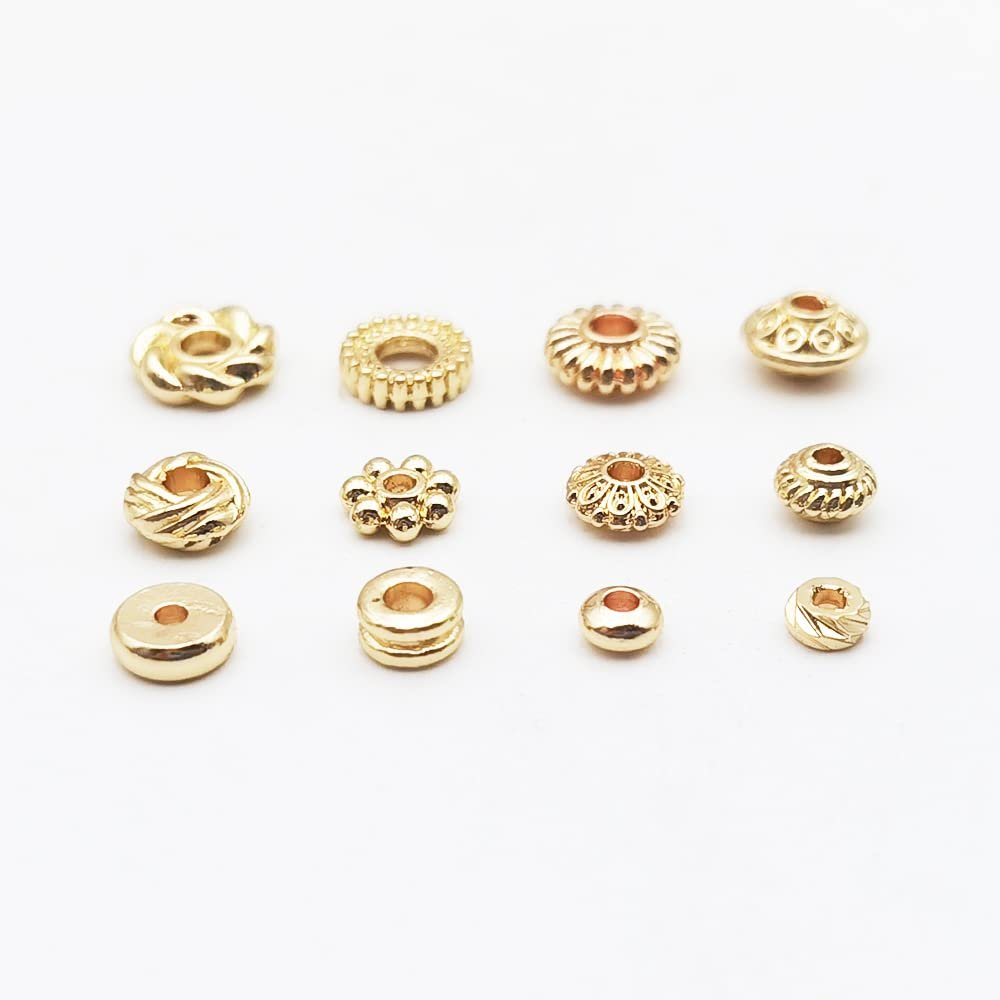 Twelve gold-plated spacer beads in various styles arranged in three rows on a white background.