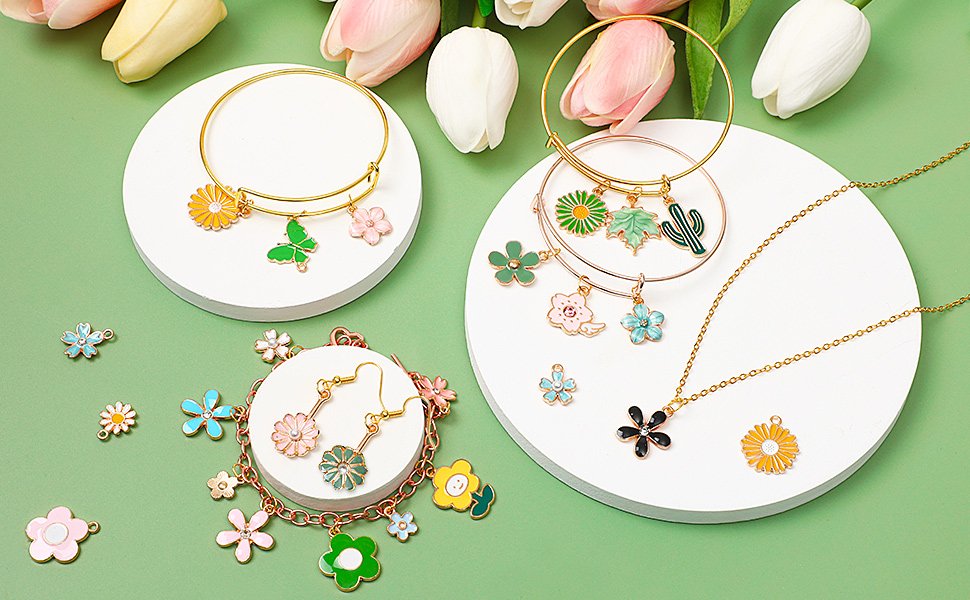 Assortment of colorful enamel flower and butterfly charms with bracelets and earrings
