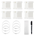 Set of white plastic embroidery floss bobbins, metal storage rings, labels, and a black marker pen on a white background.