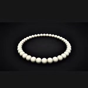 Necklace made of 6mm natural round stone beads arranged in a circle on a black background