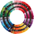 Circular arrangement of 122 skeins of embroidery floss in 61 colors, each on a black spool with gold text.