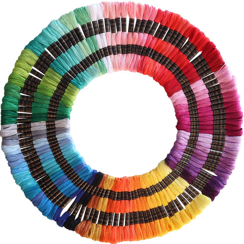 Circular arrangement of 122 skeins of embroidery floss in 61 colors, each on a black spool with gold text.