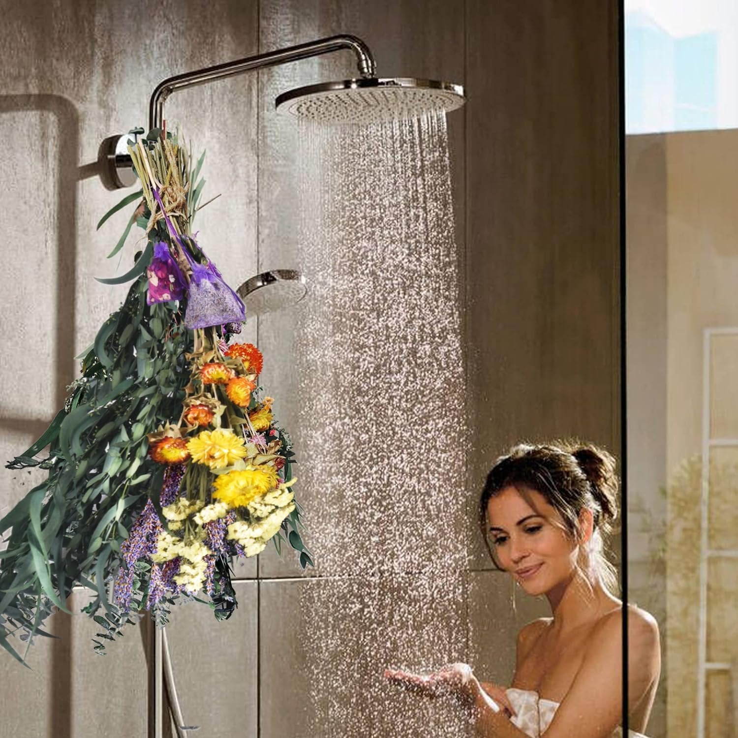 Dried eucalyptus and lavender bouquet hanging in a shower with a woman holding her hand under the water.