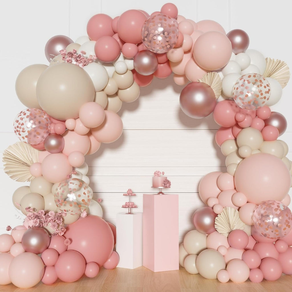 Dusty pink balloon arch garland kit with confetti and metallic balloons, featuring a cake and tiered stand.