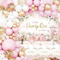 Pink and gold balloon garland arch over a baby shower backdrop with pumpkins and floral accents, featuring a tablecloth with matching design.
