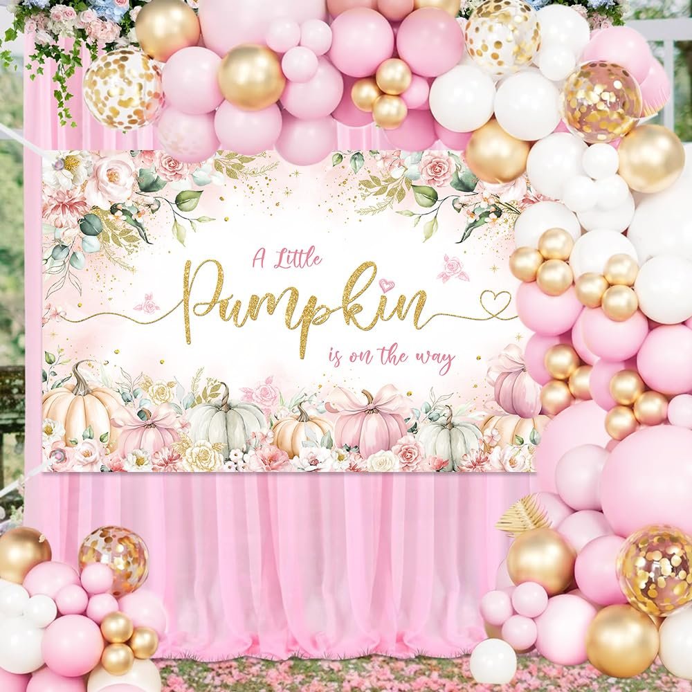 Pink and gold balloon garland framing a floral banner with pumpkins and text 'A Little Pumpkin is on the way'