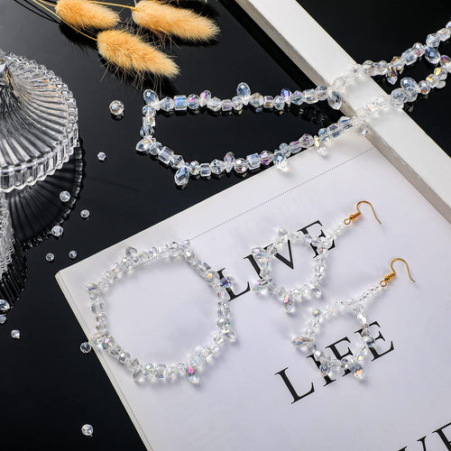 Assortment of faceted glass beads in various shapes and sizes, arranged as jewelry on a white surface with text.
