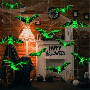 Halloween glowing skeleton bats decorations hanging indoors with cobwebs and a fireplace