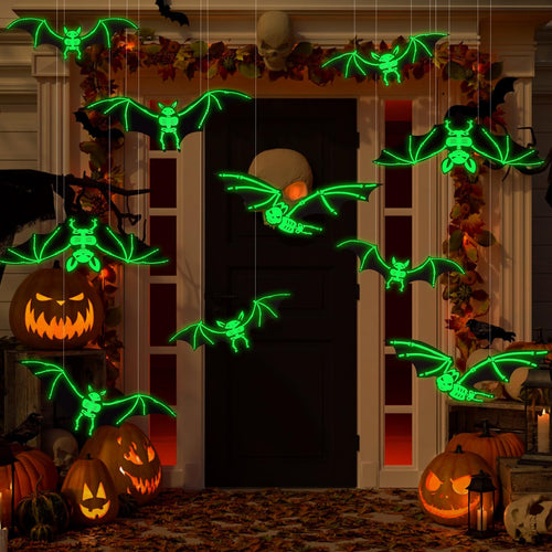 Halloween glowing skeleton bats hanging on a porch with pumpkins and skulls