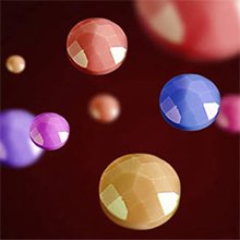 Abstract rendering of colorful faceted spheres floating against a dark background.