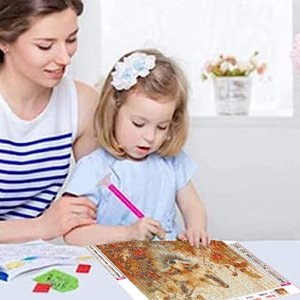 Woman and child doing a diamond painting kit featuring a fox and maple leaves