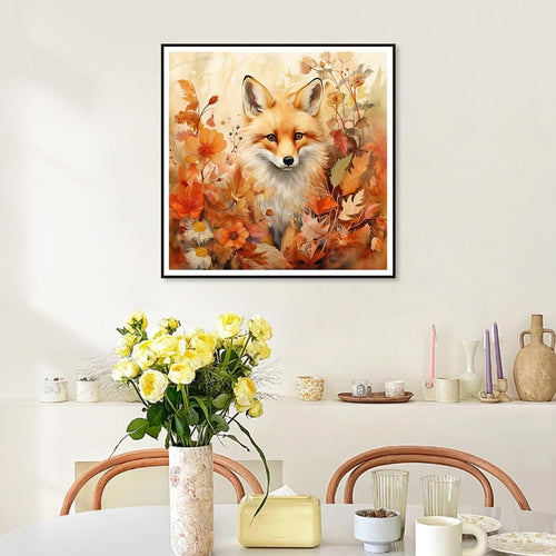 Diamond painting kit featuring a fox surrounded by fall leaves and flowers, framed on a wall.