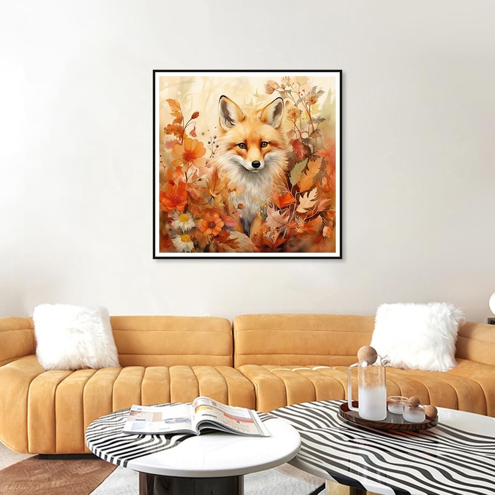 Framed 5D diamond painting of a fox surrounded by fall leaves and flowers, displayed on a wall above a sofa.