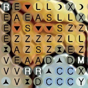 Close-up of a diamond painting canvas with symbols and letters indicating placement for colored diamonds.
