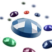 Close-up of a large blue faceted diamond gem surrounded by smaller colorful diamond gems against a white background.