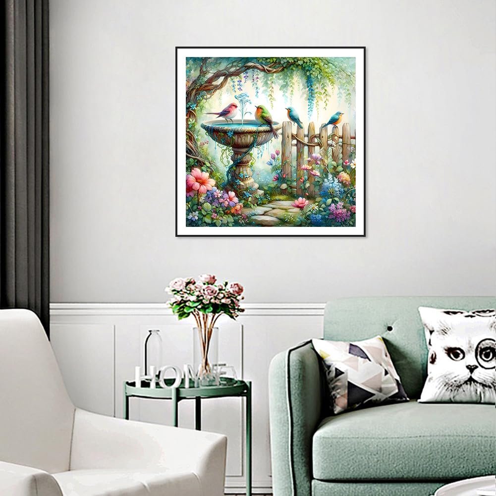 Diamond painting kit featuring a bird bath with birds, flowers, and a wooden fence in a garden setting.