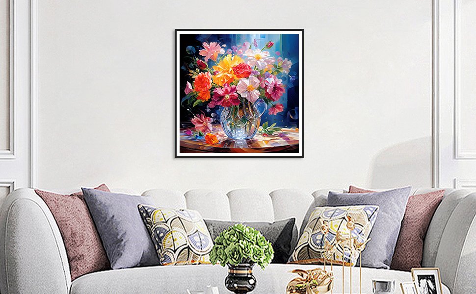 Framed 5D diamond painting of a colorful flower bouquet in a crystal vase on a patterned surface, displayed above a sofa.