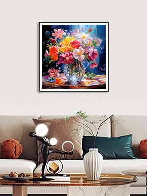 Colorful flower bouquet in a crystal vase on a table, framed artwork displayed above a sofa.