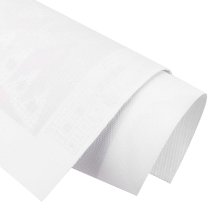 Rolled white canvas for diamond painting kit, close-up showing texture and layers.