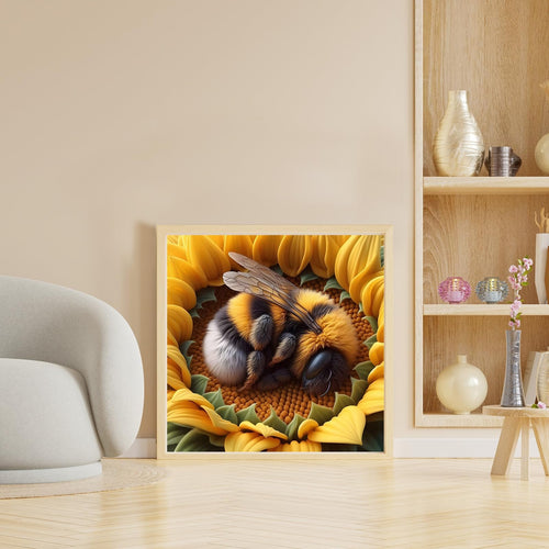 Framed diamond painting of a bumblebee sleeping on a sunflower, displayed in a living room setting.