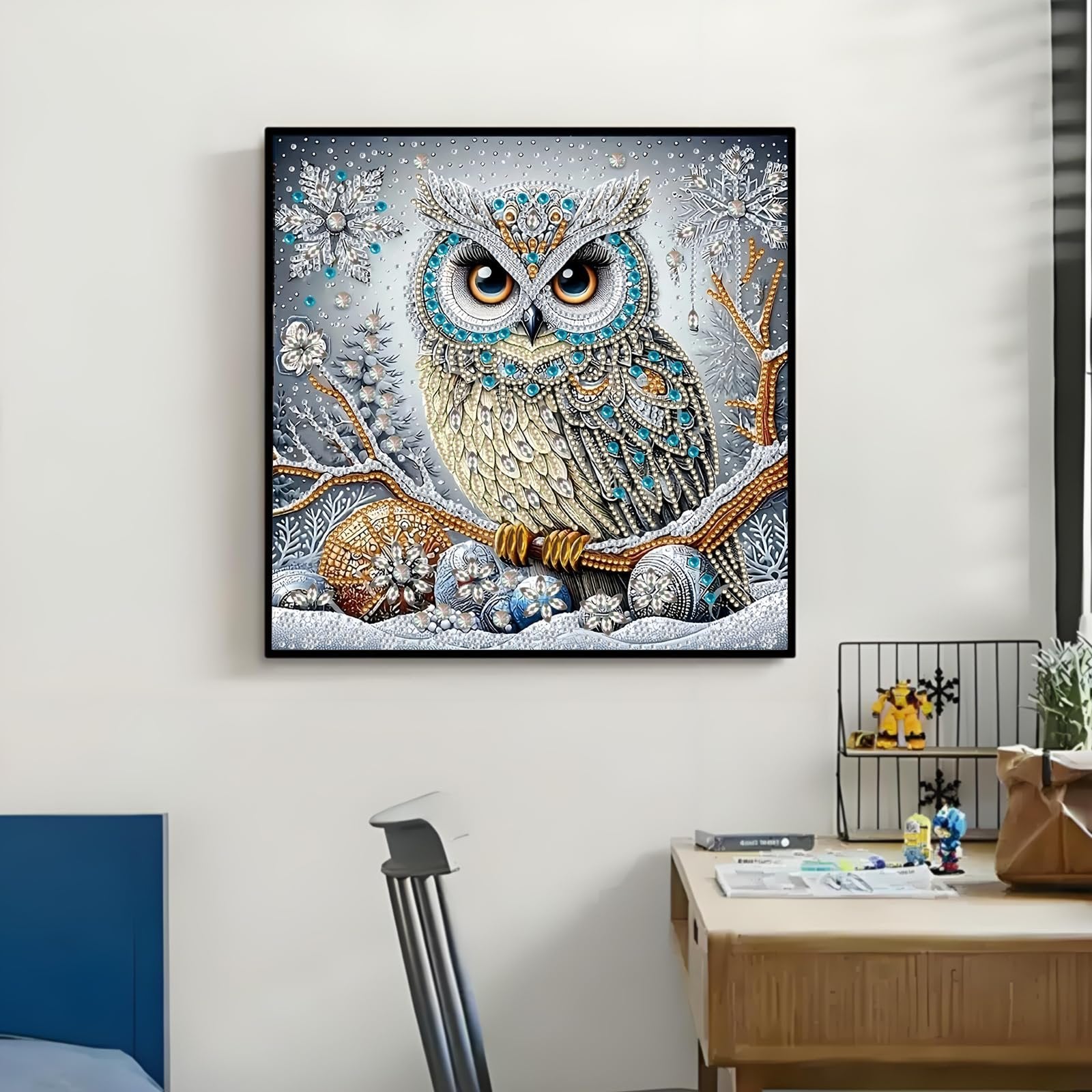 Diamond art painting of a detailed owl perched on a snowy branch with snowflakes and ornaments