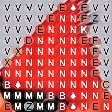 Close-up of a diamond painting canvas showing a cardinal's head with letter symbols and color dots.