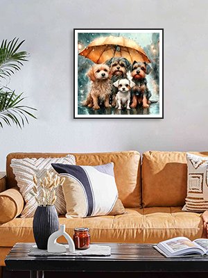 Framed 5D diamond painting of four dogs sitting under an umbrella in the rain, displayed on a wall above a sofa.