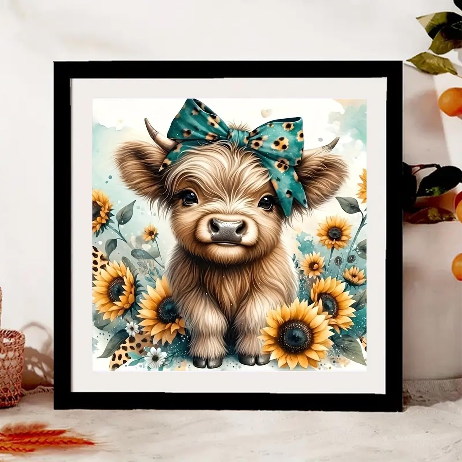 Diamond painting kit featuring a fluffy highland cow with a teal leopard print bow, surrounded by sunflowers and greenery.