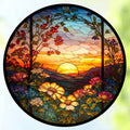 Circular stained glass panel depicting a vibrant sunset over mountains with blooming flowers in the foreground.