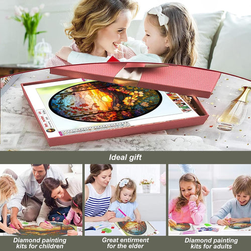 Mother and daughter opening a gift box containing a 5D diamond painting kit with a sunflower stained glass design.