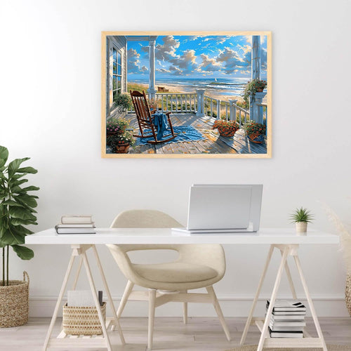 Framed diamond painting of a beach porch with rocking chair and ocean view