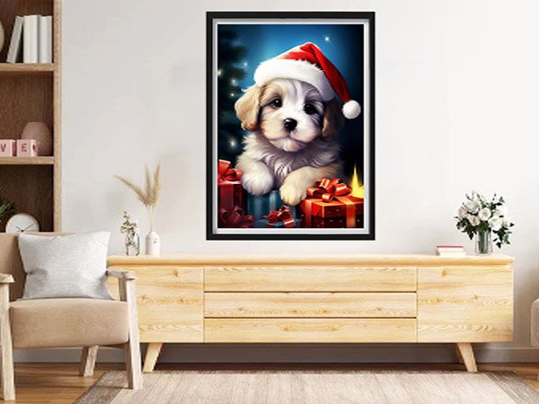 Diamond painting kit featuring a cute puppy wearing a Santa hat surrounded by Christmas gifts, displayed in a living room setting.