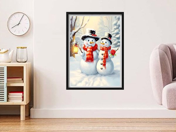 Diamond painting kit featuring two snowmen in a snowy forest scene, one holding a lantern.