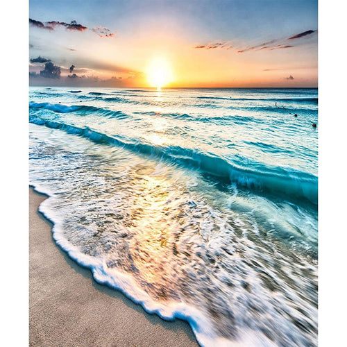 Seaside sunset with waves crashing on a sandy beach, diamond painting design.