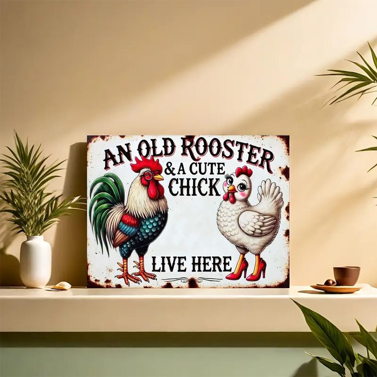 Metal sign with cartoon rooster and hen, reads 'An Old Rooster & A Cute Chick Live Here'