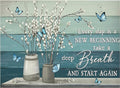 Two vases with white pussy willow branches and blue butterflies against a teal and light blue wood plank background.