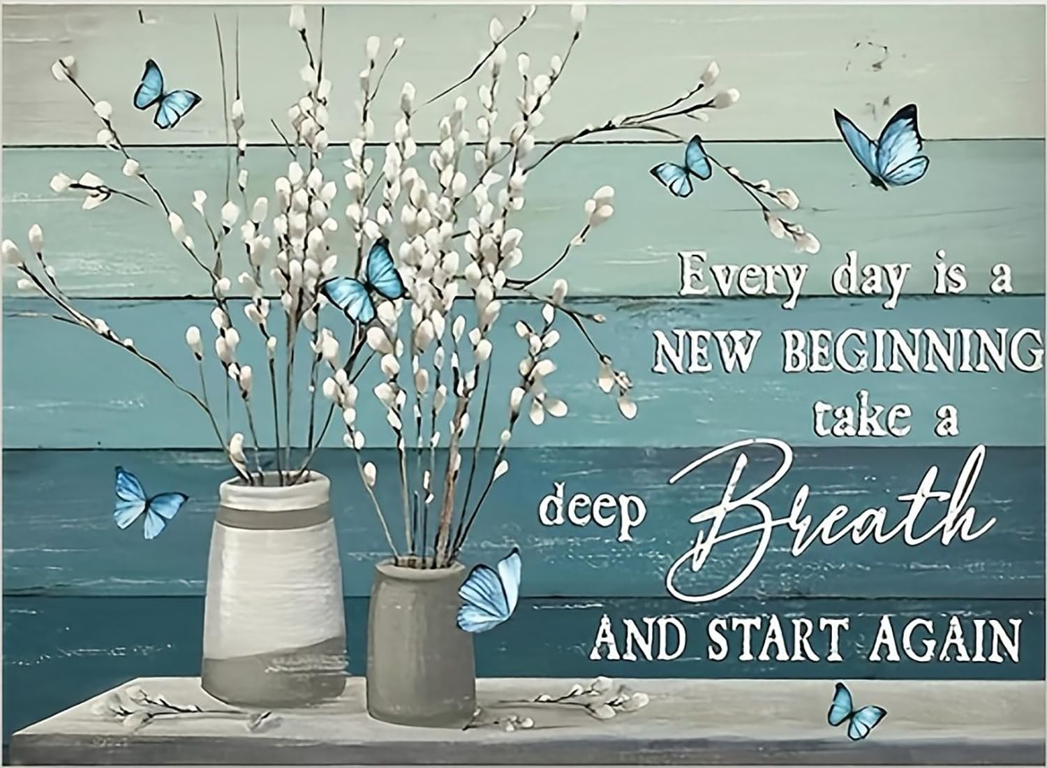 Two vases with white pussy willow branches and blue butterflies against a teal and light blue wood plank background.