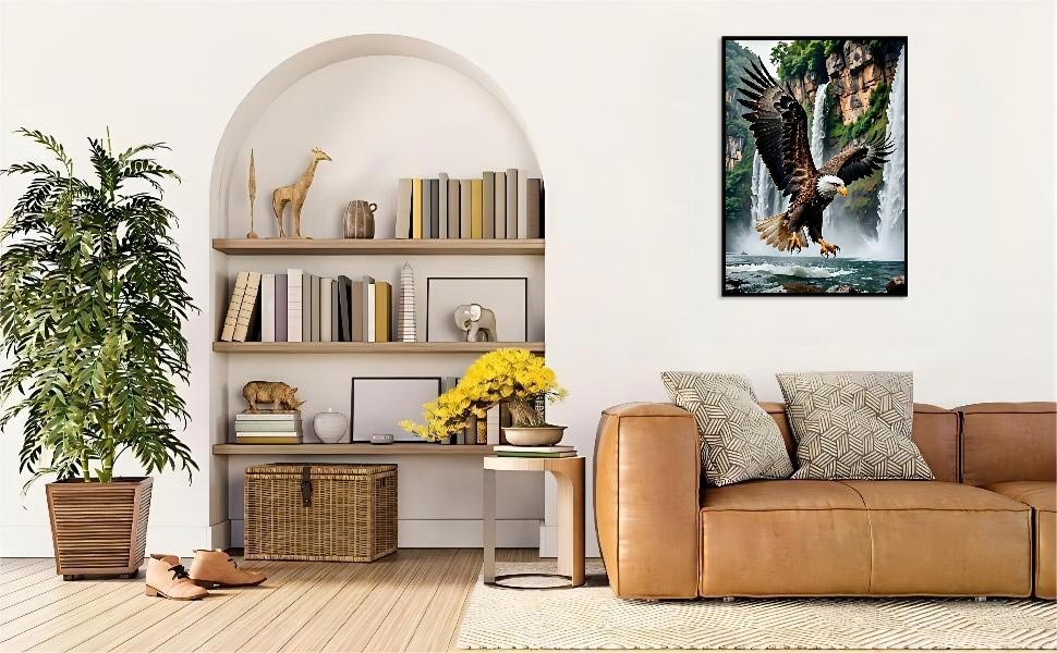 Diamond painting kit featuring a bald eagle in flight over a waterfall, displayed in a living room setting.
