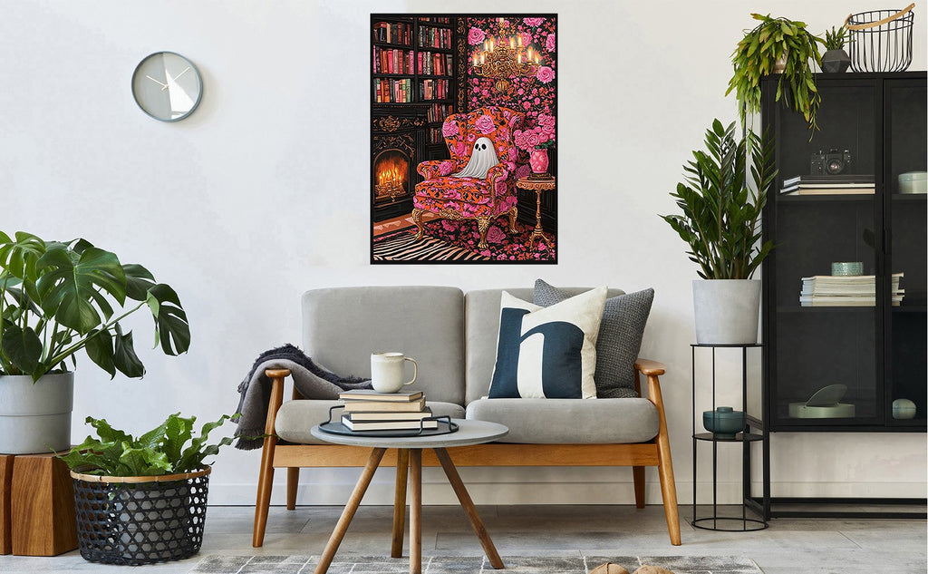 Diamond art kit painting of a ghost sitting in a floral armchair in a library setting, displayed in a living room.