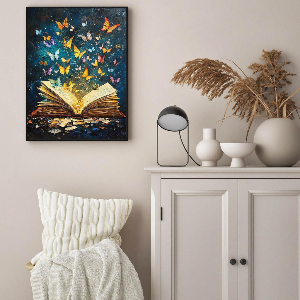 Diamond painting of an open book with butterflies emerging from its pages, displayed on a wall.